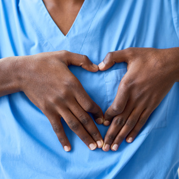 making heart with a hands over chest